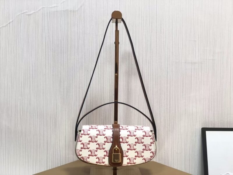 Clutch on Strap Tabou in Triomphe Canvas and Calfskin - Red Tan (1)